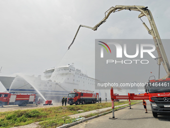 Firefighting equipment is carrying out firefighting and rescue on a damaged ship during the National Defense Mobilization Comprehensive Dril...