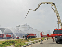 Firefighting equipment is carrying out firefighting and rescue on a damaged ship during the National Defense Mobilization Comprehensive Dril...