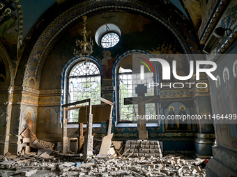 The interior of the Church of the Nativity of the Blessed Virgin Mary is being damaged by the Russian shelling in Novoekonomichne, Ukraine,...