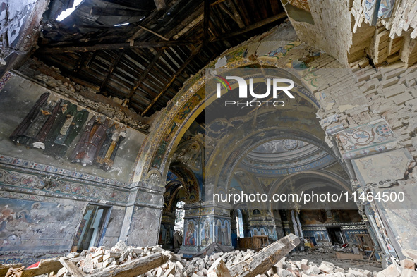 The interior of the Church of the Nativity of the Blessed Virgin Mary is being damaged by the Russian shelling in Novoekonomichne, Ukraine,...