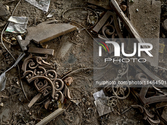 Broken pieces of decorations are covering the floor at the Church of the Nativity of the Blessed Virgin Mary, damaged by the Russian shellin...