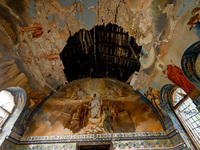 The interior of the Church of the Nativity of the Blessed Virgin Mary is being damaged by the Russian shelling in Novoekonomichne, Ukraine,...