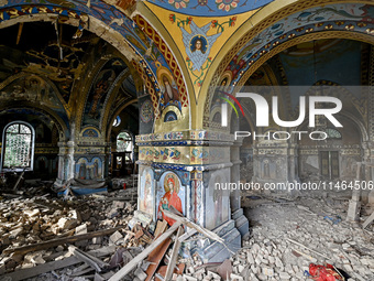 The interior of the Church of the Nativity of the Blessed Virgin Mary is being damaged by the Russian shelling in Novoekonomichne, Ukraine,...