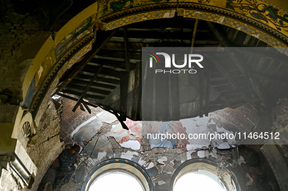 The interior of the Church of the Nativity of the Blessed Virgin Mary is being damaged by the Russian shelling in Novoekonomichne, Ukraine,...