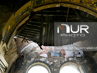 The interior of the Church of the Nativity of the Blessed Virgin Mary is being damaged by the Russian shelling in Novoekonomichne, Ukraine,...