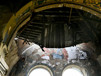 The interior of the Church of the Nativity of the Blessed Virgin Mary is being damaged by the Russian shelling in Novoekonomichne, Ukraine,...