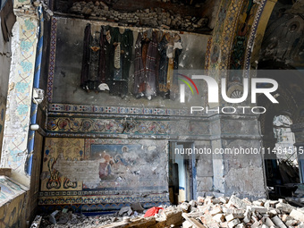 The interior of the Church of the Nativity of the Blessed Virgin Mary is being damaged by the Russian shelling in Novoekonomichne, Ukraine,...