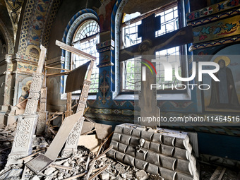 The interior of the Church of the Nativity of the Blessed Virgin Mary is being damaged by the Russian shelling in Novoekonomichne, Ukraine,...