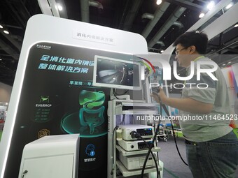 Visitors are experiencing ''Gastrointestinal endoscopy'' at the 30th China International Medical Instruments and Equipment Exhibition in Bei...