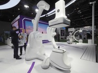 Visitors are visiting a ''high-end composite operating room robot'' at the 30th China International Medical Instruments and Equipment Exhibi...