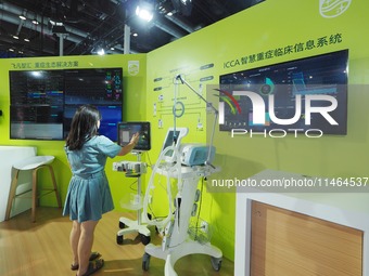 Visitors are experiencing ''Critical care systems'' at the 30th China International Medical Instruments and Equipment Exhibition in Beijing,...