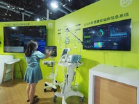 Visitors are experiencing ''Critical care systems'' at the 30th China International Medical Instruments and Equipment Exhibition in Beijing,...