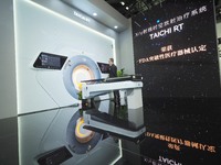 Visitors are experiencing the ''X/Y Ray Time-Space Radiotherapy System'' at the 30th China International Medical Instruments and Equipment E...