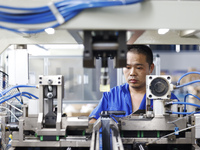 Workers are working at a production workshop of an auto parts company in Suqian, Jiangsu province, China, on August 9, 2024. (