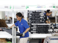 Workers are working at a production workshop of an auto parts company in Suqian, Jiangsu province, China, on August 9, 2024. (