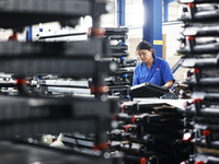 Workers are working at a production workshop of an auto parts company in Suqian, Jiangsu province, China, on August 9, 2024. (