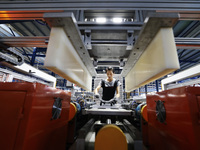 Workers are working at a production workshop of an auto parts company in Suqian, Jiangsu province, China, on August 9, 2024. (