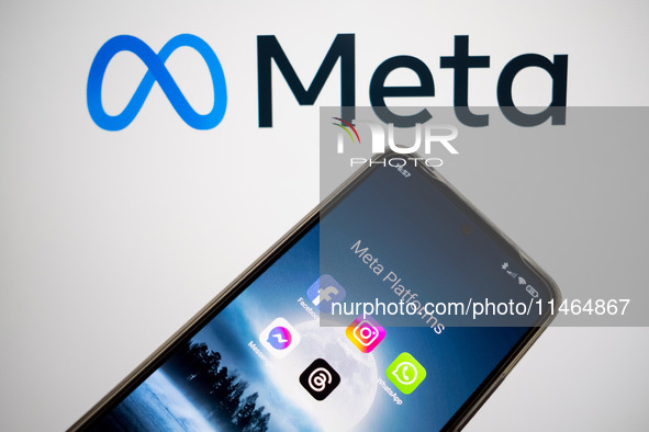 Meta platforms are being displayed on a smartphone screen, and the Meta logo is appearing in the background in Chania, Greece, on August 9,...