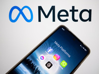 Meta platforms are being displayed on a smartphone screen, and the Meta logo is appearing in the background in Chania, Greece, on August 9,...