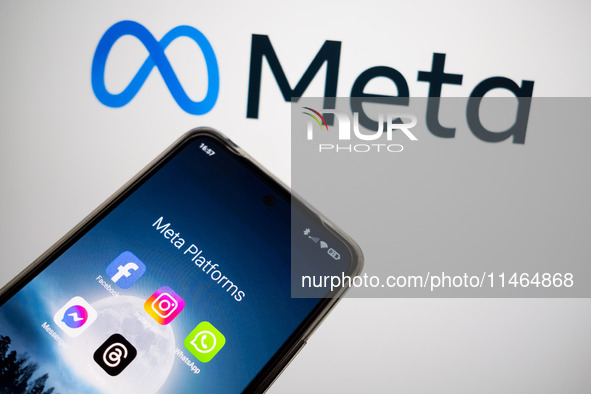 Meta platforms are being displayed on a smartphone screen, and the Meta logo is appearing in the background in Chania, Greece, on August 9,...