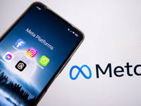 Meta platforms are being displayed on a smartphone screen, and the Meta logo is appearing in the background in Chania, Greece, on August 9,...