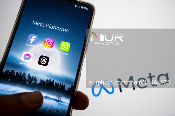 Meta platforms are being displayed on a smartphone screen, and the Meta logo is appearing in the background in Chania, Greece, on August 9,...