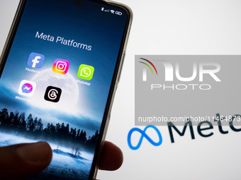 Meta platforms are being displayed on a smartphone screen, and the Meta logo is appearing in the background in Chania, Greece, on August 9,...