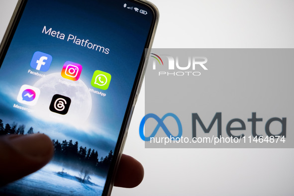 Meta platforms are being displayed on a smartphone screen, and the Meta logo is appearing in the background in Chania, Greece, on August 9,...