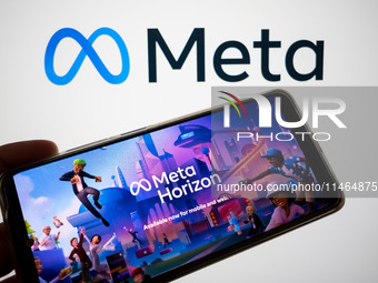 The Meta Horizon Worlds is being displayed on a smartphone screen, and the Meta logo is in the background in Chania, Greece, on August 9, 20...