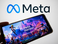 The Meta Horizon Worlds is being displayed on a smartphone screen, and the Meta logo is in the background in Chania, Greece, on August 9, 20...