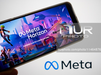 The Meta Horizon Worlds is being displayed on a smartphone screen, and the Meta logo is in the background in Chania, Greece, on August 9, 20...