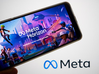 The Meta Horizon Worlds is being displayed on a smartphone screen, and the Meta logo is in the background in Chania, Greece, on August 9, 20...