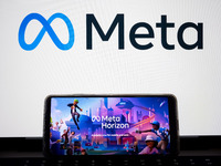 The Meta Horizon Worlds is being displayed on a smartphone screen, and the Meta logo is in the background in Chania, Greece, on August 9, 20...