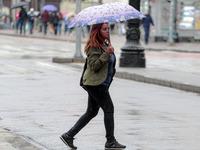 Pedestrians are protecting themselves from the rain in the central region of Sao Paulo, Brazil, on Friday, August 9. (