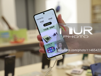 People are shopping for a Huawei nova Flip foldable mobile phone at a Huawei mobile phone store in Xi'an, Shaanxi province, China, on August...