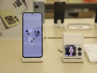 People are shopping for a Huawei nova Flip foldable mobile phone at a Huawei mobile phone store in Xi'an, Shaanxi province, China, on August...