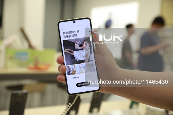 People are shopping for a Huawei nova Flip foldable mobile phone at a Huawei mobile phone store in Xi'an, Shaanxi province, China, on August...