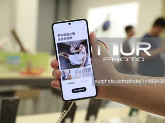 People are shopping for a Huawei nova Flip foldable mobile phone at a Huawei mobile phone store in Xi'an, Shaanxi province, China, on August...