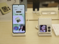 People are shopping for a Huawei nova Flip foldable mobile phone at a Huawei mobile phone store in Xi'an, Shaanxi province, China, on August...