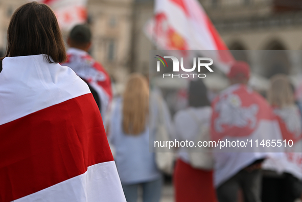 KRAKOW, POLAND - AUGUST 9:
Members of the Belarusian diaspora, many displaying white-red-white opposition flags, gather at Krakow's Market S...