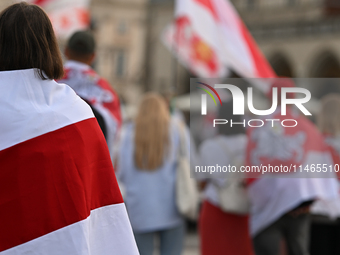 KRAKOW, POLAND - AUGUST 9:
Members of the Belarusian diaspora, many displaying white-red-white opposition flags, gather at Krakow's Market S...