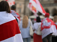 KRAKOW, POLAND - AUGUST 9:
Members of the Belarusian diaspora, many displaying white-red-white opposition flags, gather at Krakow's Market S...