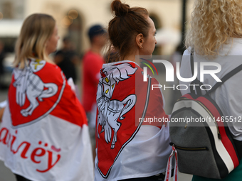 KRAKOW, POLAND - AUGUST 9:
Members of the Belarusian diaspora, many displaying white-red-white opposition flags, gather at Krakow's Market S...