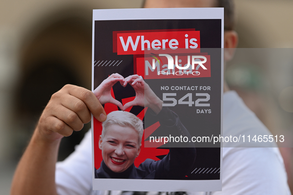 KRAKOW, POLAND - AUGUST 9:
A member of the Belarusian diaspora holds a poster with the inscription 'Where is Maria? No contact for 542 days,...