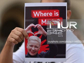 KRAKOW, POLAND - AUGUST 9:
A member of the Belarusian diaspora holds a poster with the inscription 'Where is Maria? No contact for 542 days,...