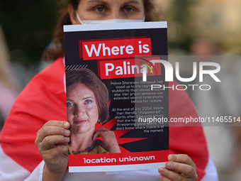 KRAKOW, POLAND - AUGUST 9:
A member of the Belarusian diaspora holds a poster with the inscription 'Where is Palina? Location unknown,' feat...