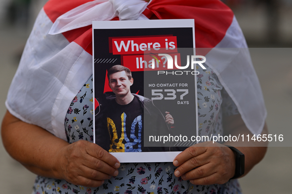 KRAKOW, POLAND - AUGUST 9:
A member of the Belarusian diaspora holds a poster with the inscription 'Where is Ihar? No contact for 537 days,'...