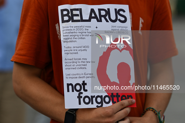 KRAKOW, POLAND - AUGUST 9:
A member of the Belarusian diaspora holds a poster with the inscription 'Belarus Not FOrgotten', during the Day o...