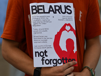 KRAKOW, POLAND - AUGUST 9:
A member of the Belarusian diaspora holds a poster with the inscription 'Belarus Not FOrgotten', during the Day o...