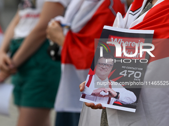 KRAKOW, POLAND - AUGUST 9:
A member of the Belarusian diaspora holds a poster with the inscription 'Where is Viktar? No contact for 470 days...